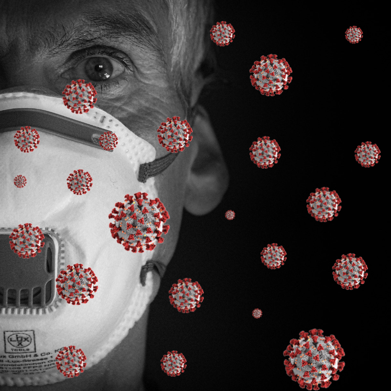 Masked man surrounded by floating germ particles. Acupuncture- Health Wellness Articles- Studio City, Toluca Lake, CA